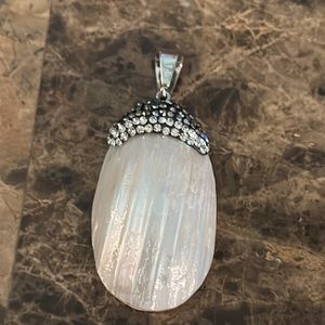 Pendant shell encased in crystal layers and layers silver tone bale mother of